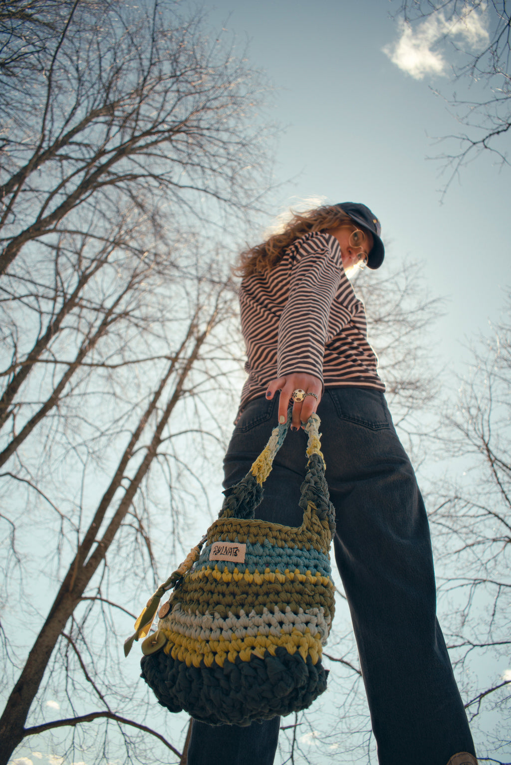 bohemian outfit with green crochet bag