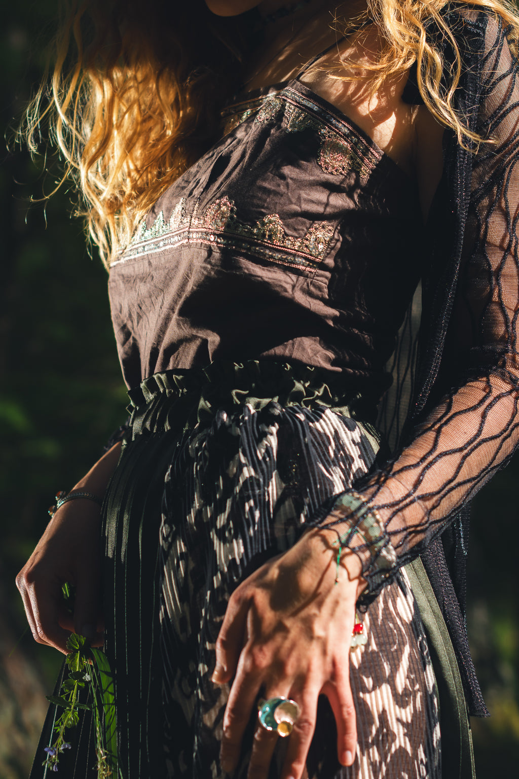 Close up waist detail of handmade emerald green slit midi skirt