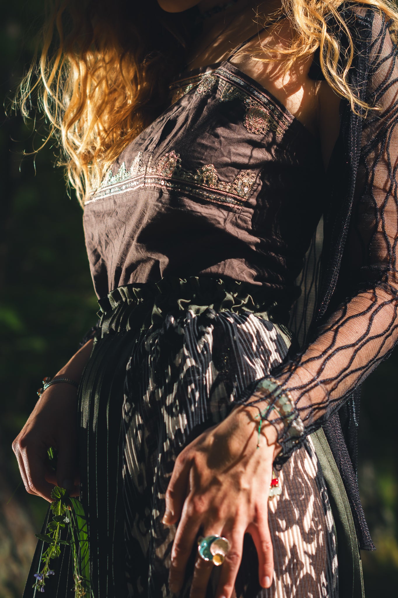Close up waist detail of handmade emerald green slit midi skirt