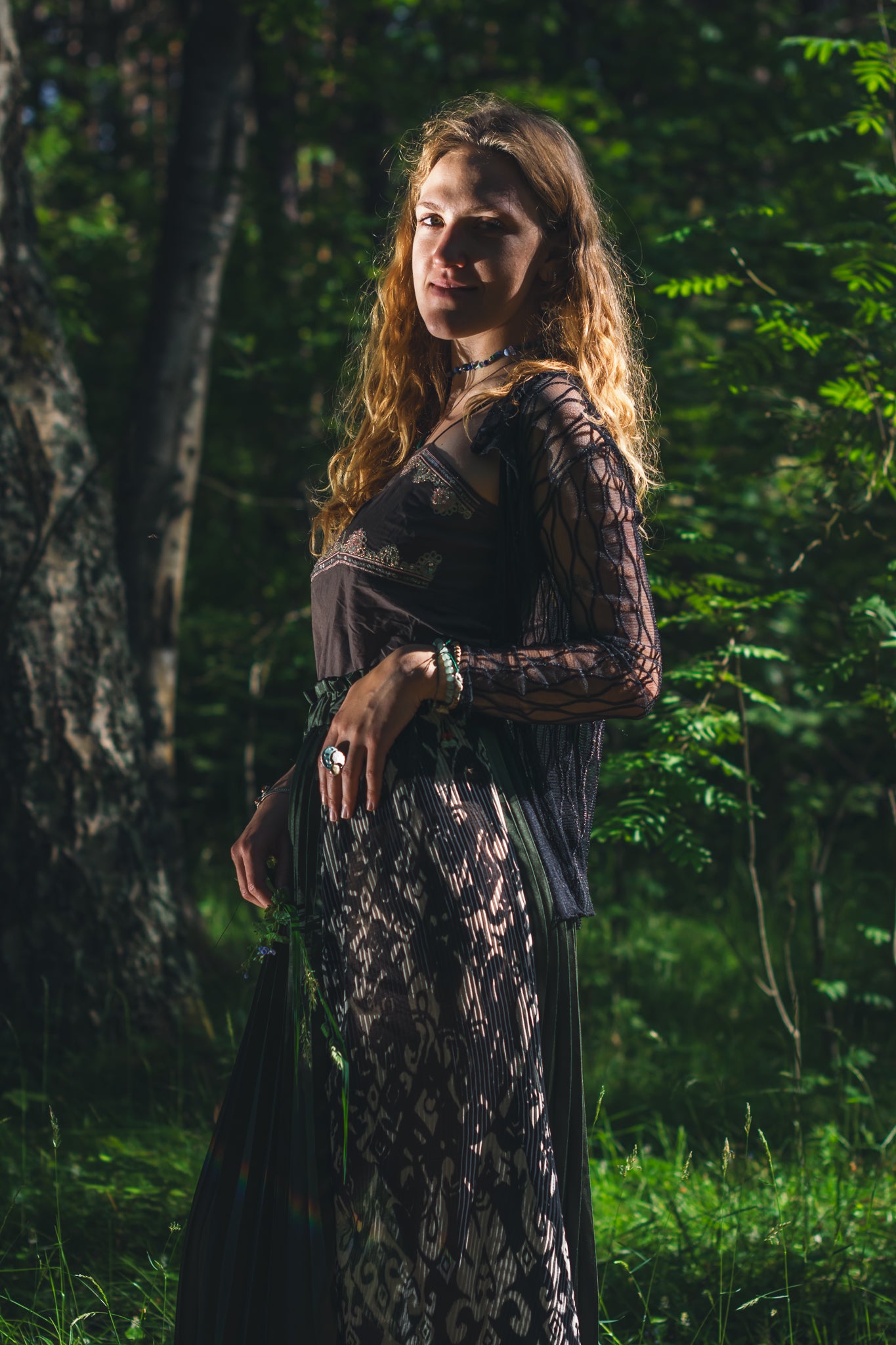 Emerald green slit midi skirt styled on model