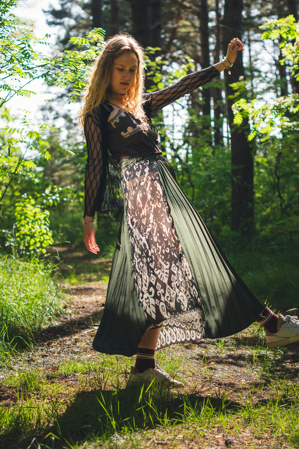Emerald green slit midi skirt showing movement while walking