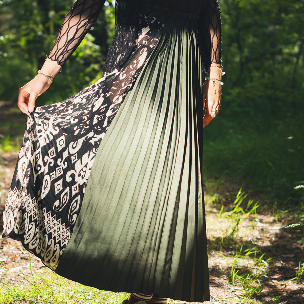 Handmade emerald green slit midi skirt photographed in natural light