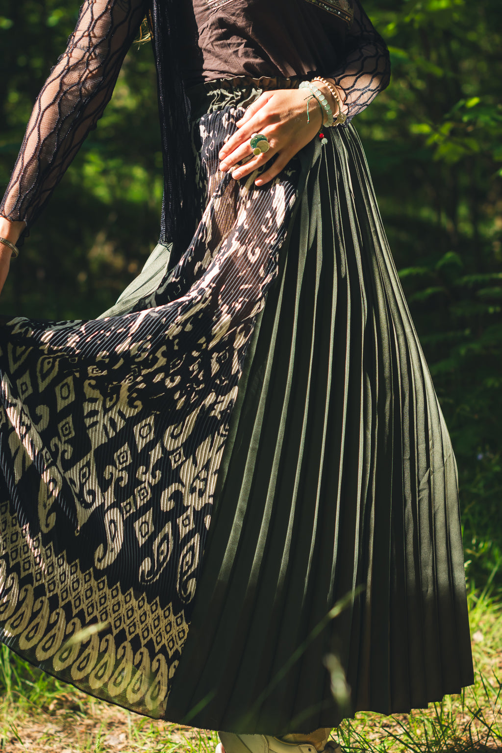 Side slit detail on emerald green midi skirt