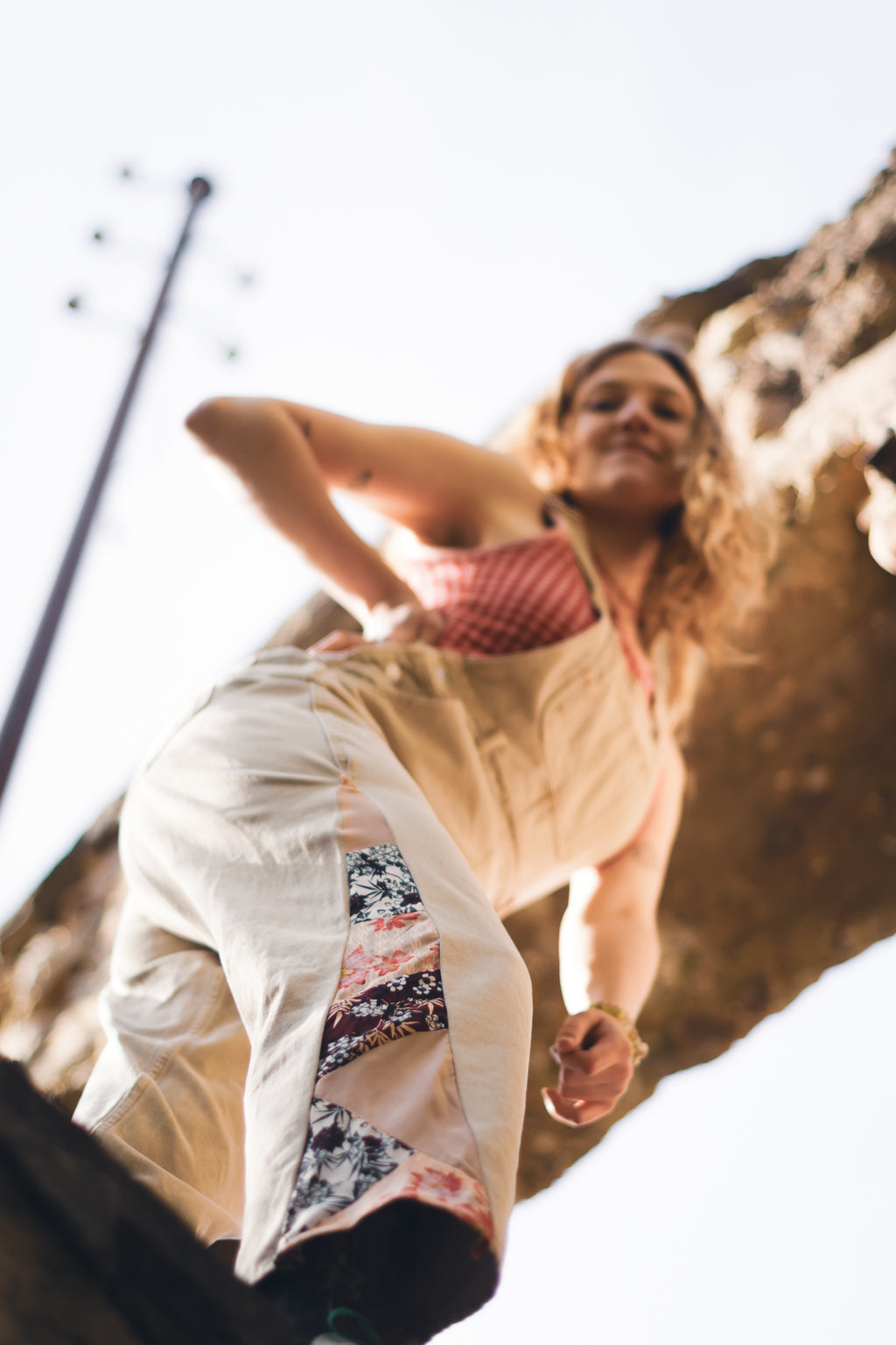 Handmade patchwork denim dungarees photographed in natural light