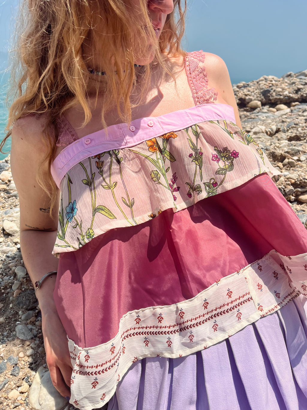 Fabric texture detail of bright pink upcycled summer crop top