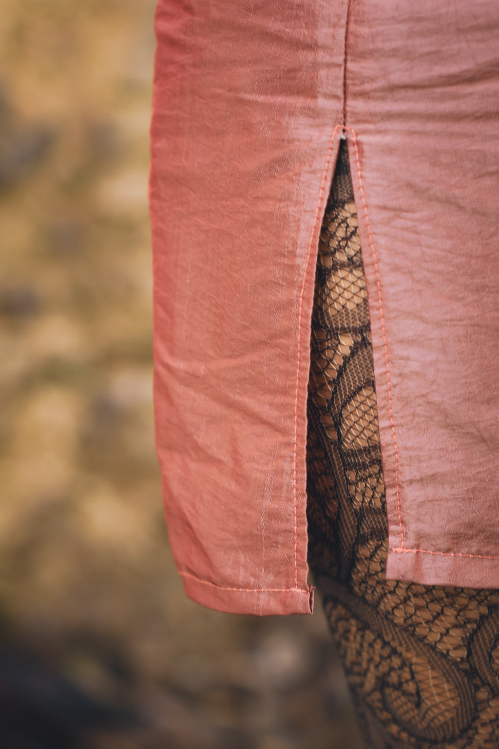 Side slit detail on hot pink upcycled mini skirt