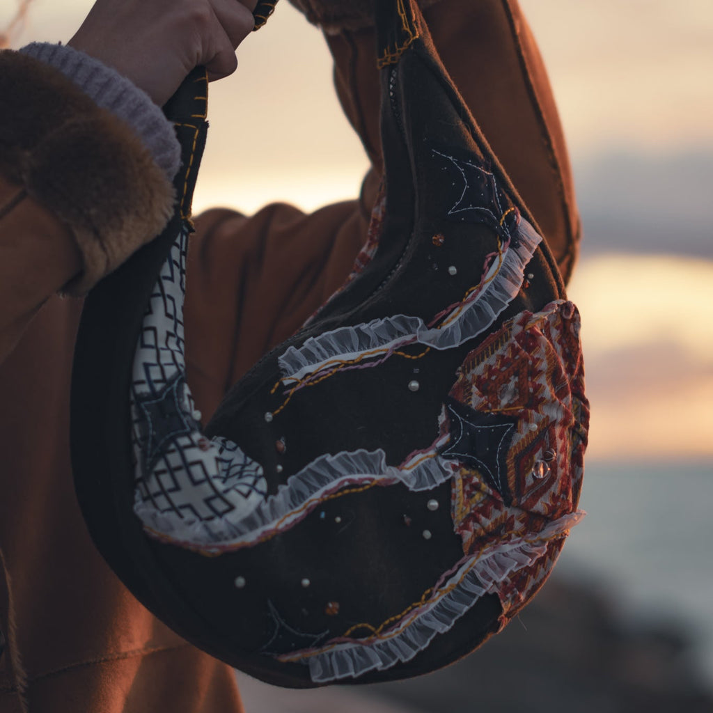 Handmade upcycled tote bag with sun and moon embroidery, front view, eco-friendly reversible purse