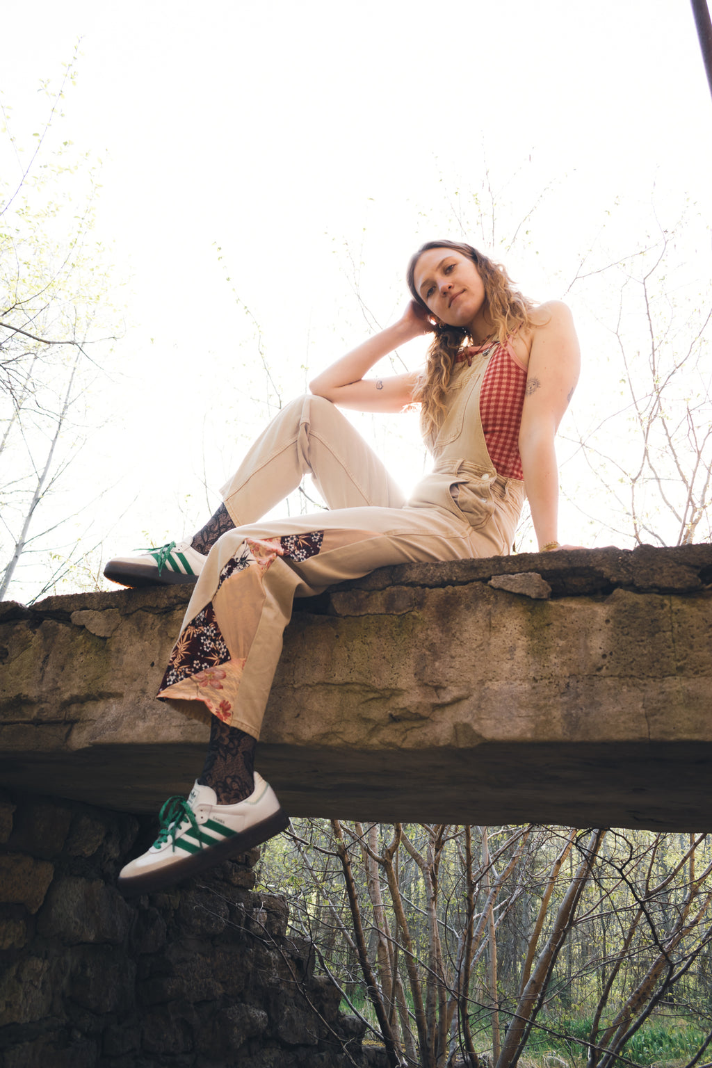 Sustainable upcycled denim overalls styled on model