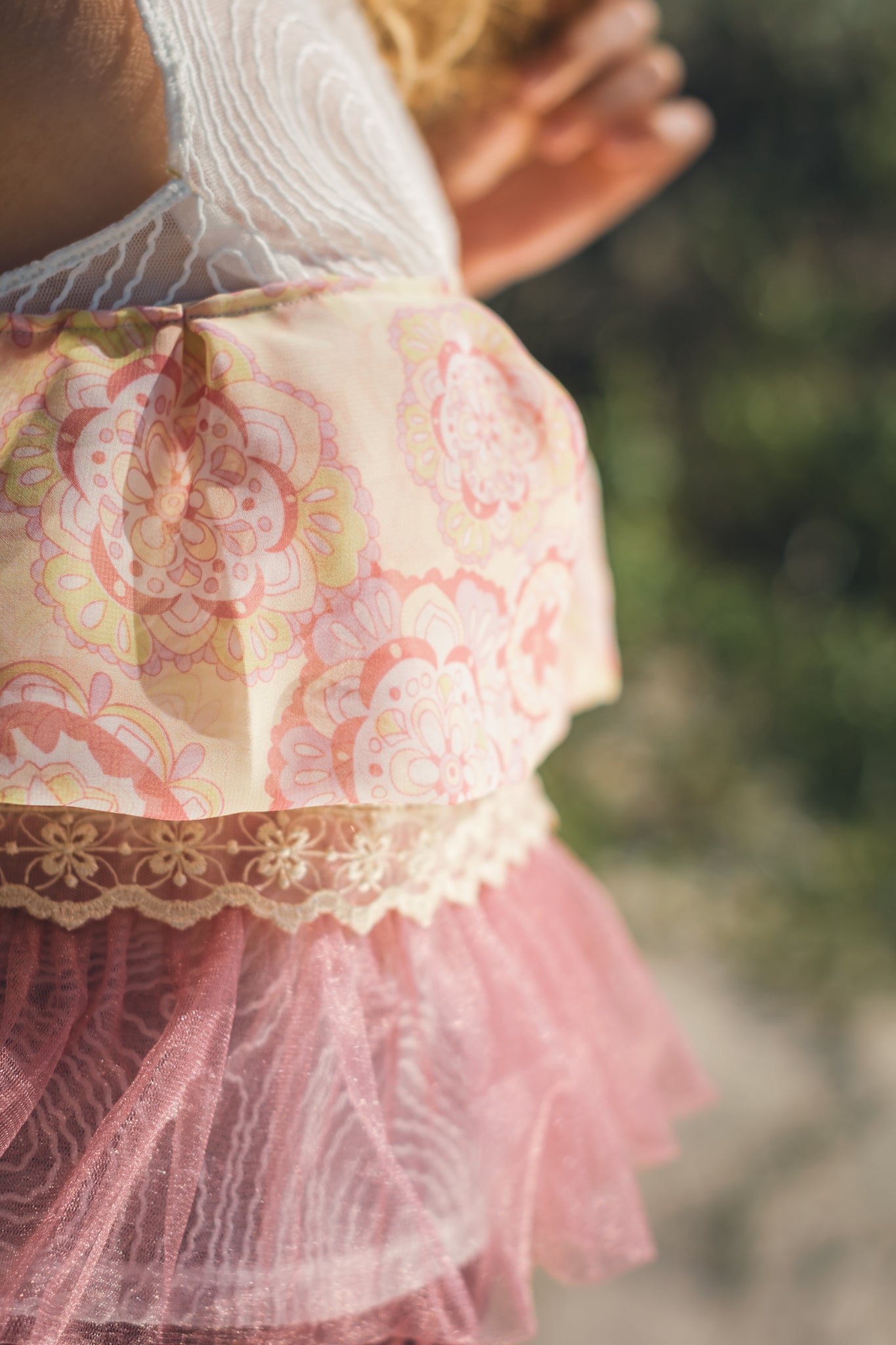 Close up fabric detail of upcycled blush pink lightweight top