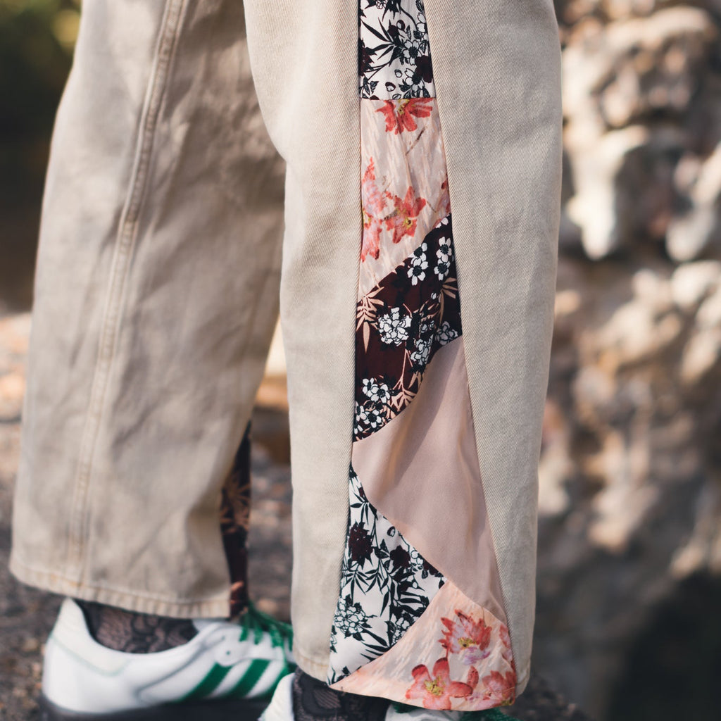 Close up of original patchwork on reworked denim overalls