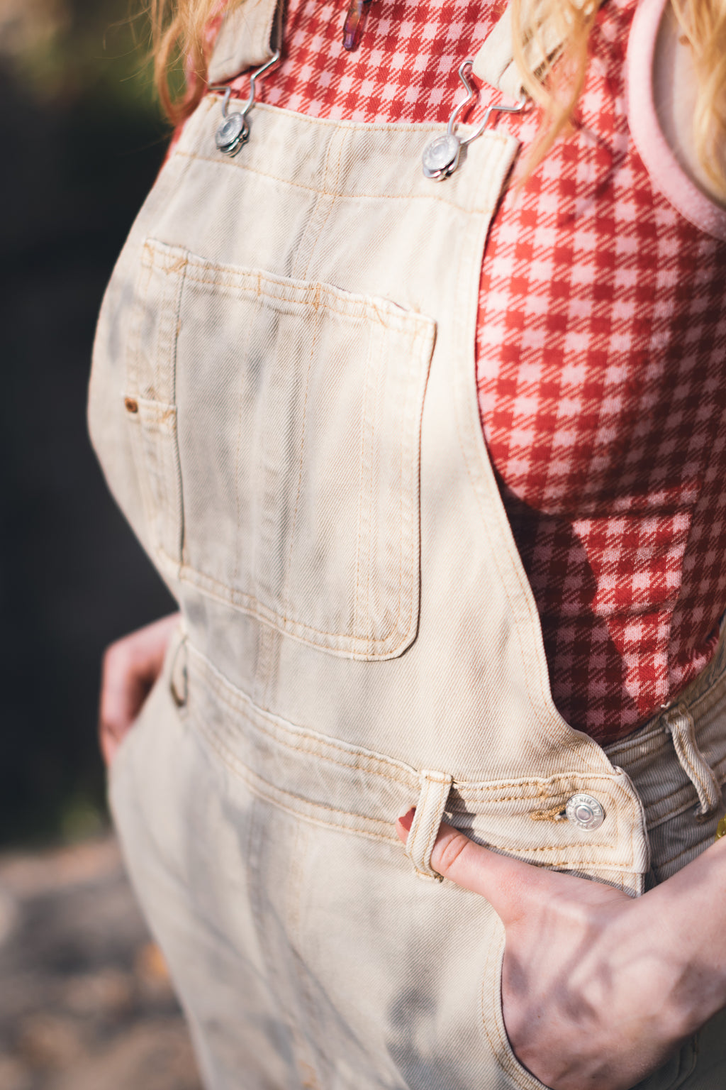 Upcycled vintage denim overalls showing functional pockets