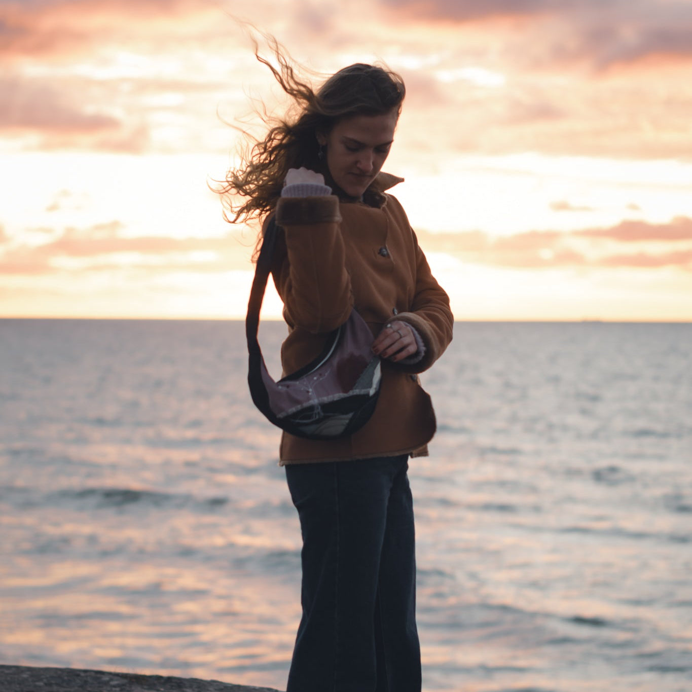 Handmade upcycled hobo bag worn over shoulder, stylish reversible eco-friendly purse for daily use