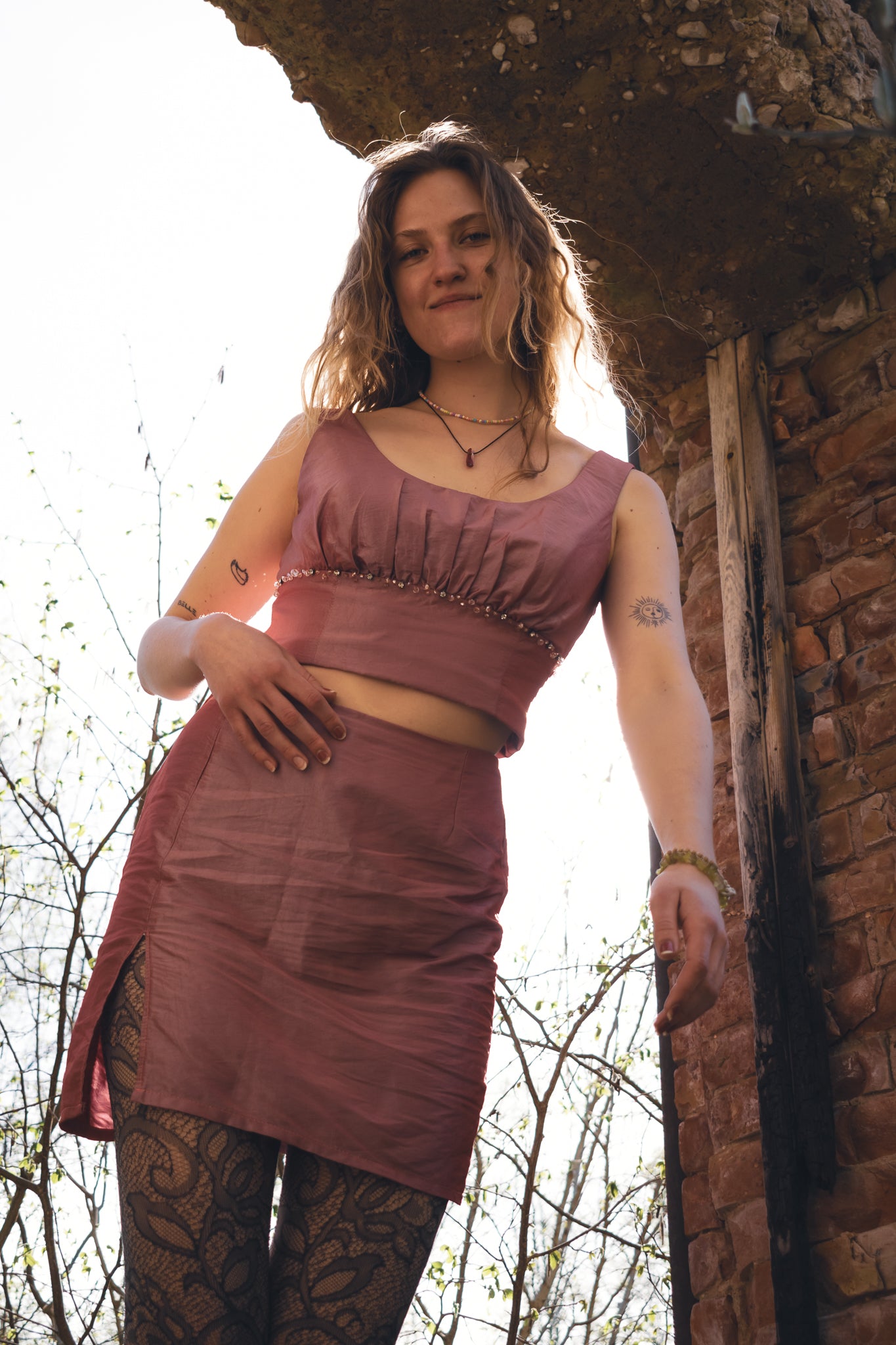 Upcycled hot pink two-piece skirt set styled on model for summer outfit