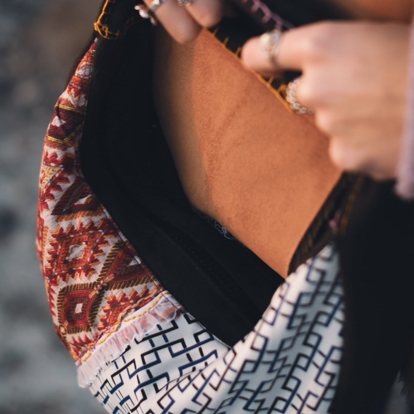 Durable black zipper and stitching detail on handmade upcycled tote bag, sustainable reversible handbag